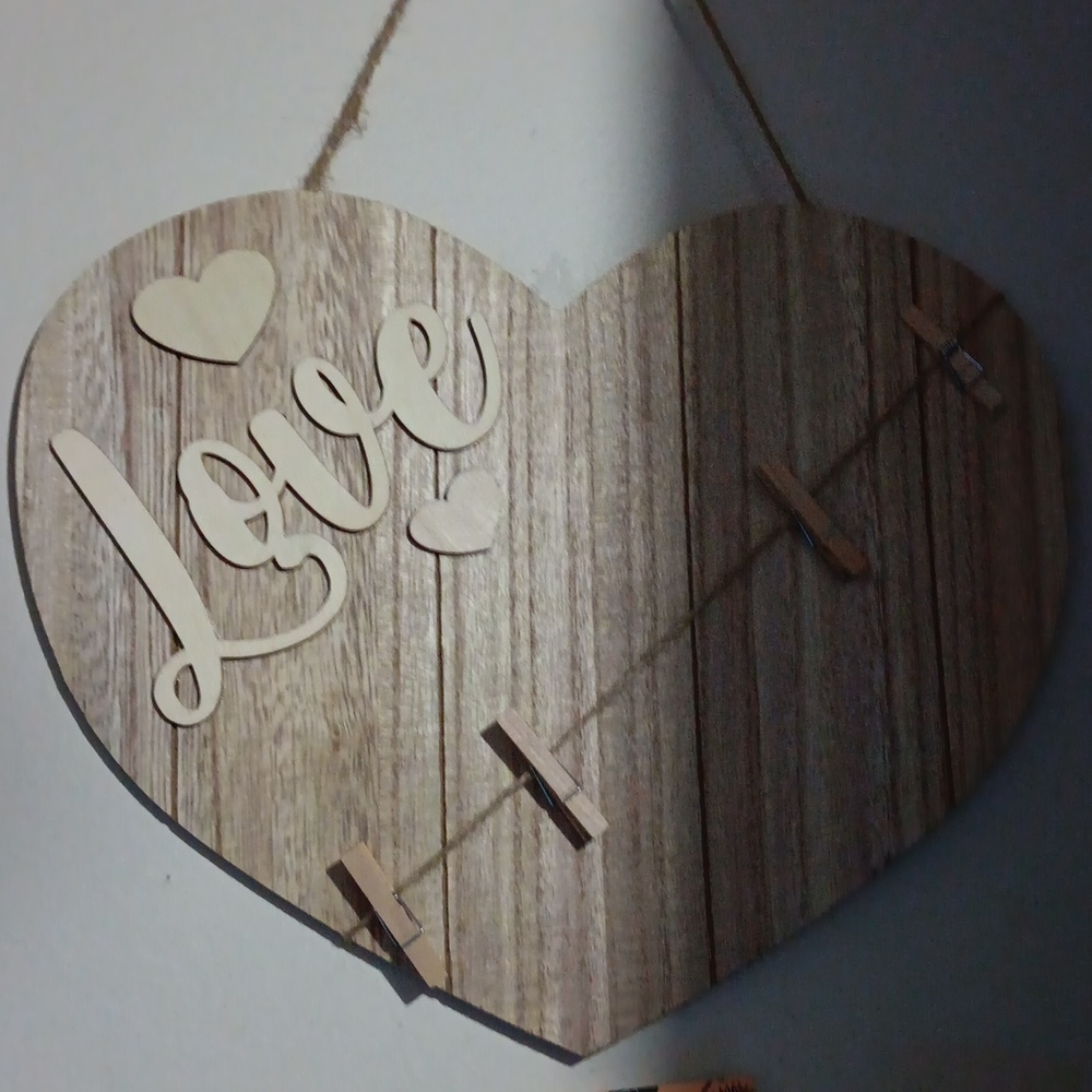 Sign with clips that says love